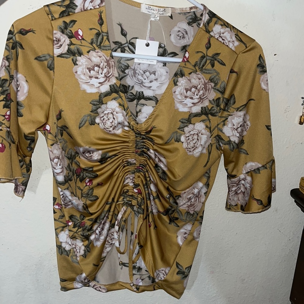 I’m selling a causal shirt, size small with a soft silky texture.